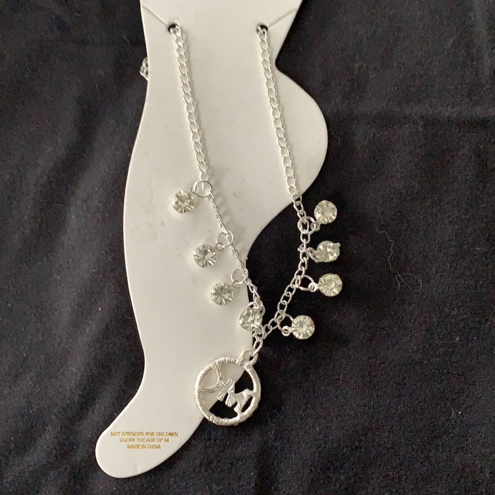 5/$25 Silvertone/rhinestone anklet with charm and lobster claw closure.